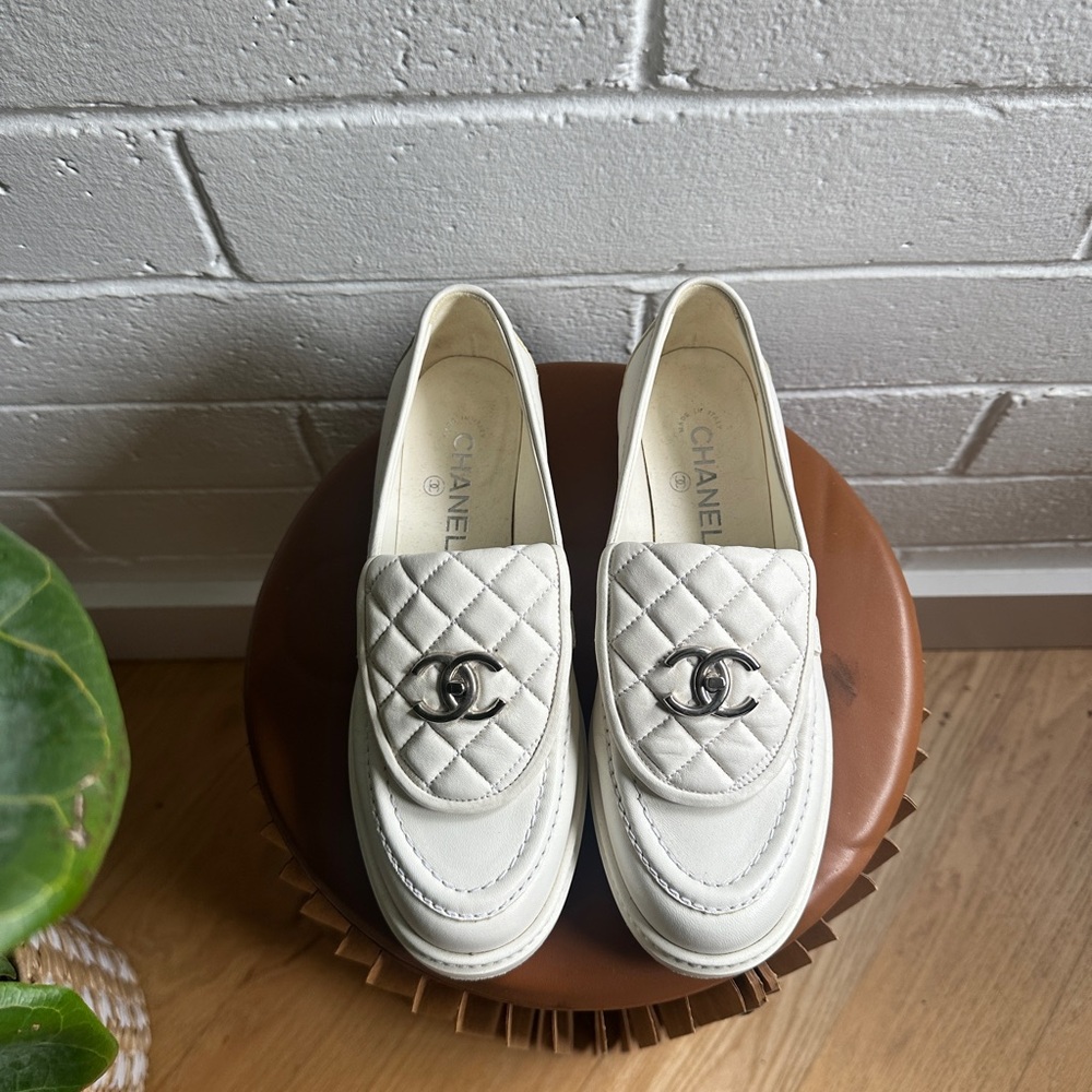 CHANEL Cream Quilted Loafers with Silver Logo